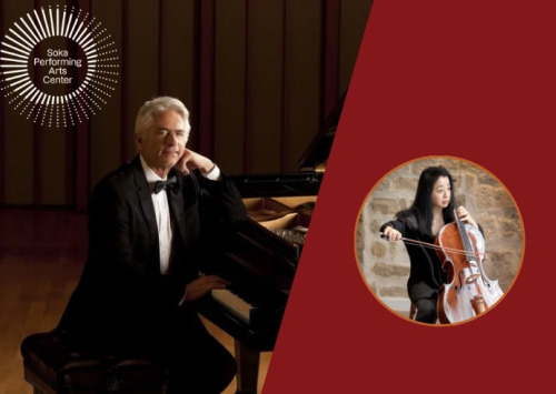 Man in black suit sitting at the piano and woman standing with a cello